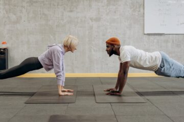 man and woman doing push up